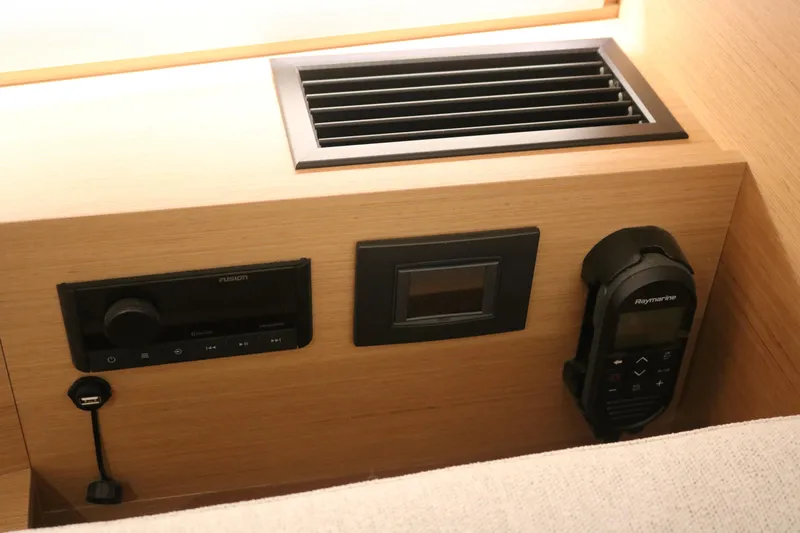 Slide: The Image of Control panel of 2026 Jeanneau Sun Odyssey 415 yacht, featuring modern navigation and audio systems. - 43