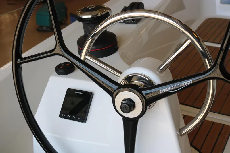 Slide: The Image of Steering wheel of 2026 Jeanneau Sun Odyssey 415 sailboat with Carbonautica design. - 10