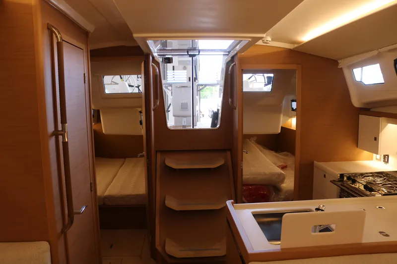Slide: The Image of Interior of 2026 Jeanneau Sun Odyssey 415 yacht, featuring cozy cabins and modern kitchen amenities. - 33