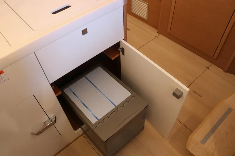 Slide: The Image of Interior of 2026 Jeanneau Sun Odyssey 415 yacht showing open storage compartment. - 48