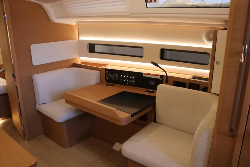 Slide: The Image of Interior of 2026 Jeanneau Sun Odyssey 415 yacht, featuring a cozy seating area and modern design. - 38