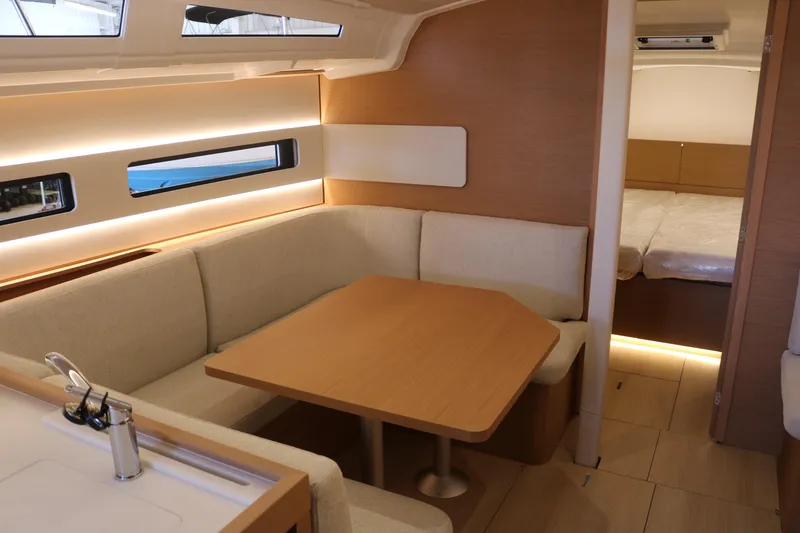 Slide: The Image of Modern interior of 2026 Jeanneau Sun Odyssey 415 yacht with cozy seating and dining area. - 40