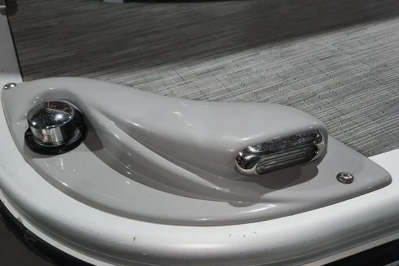 Slide: The Image of 2022 Bennington 198SL boat detail with chrome fixtures and textured flooring. - 21