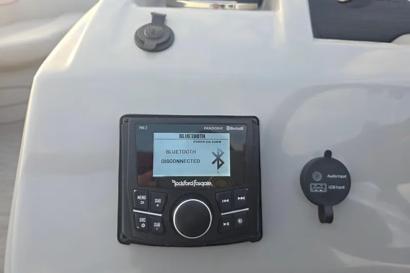 Slide: The Image of Control panel of a 2022 Bennington 198SL boat with Bluetooth and audio input features. - 39