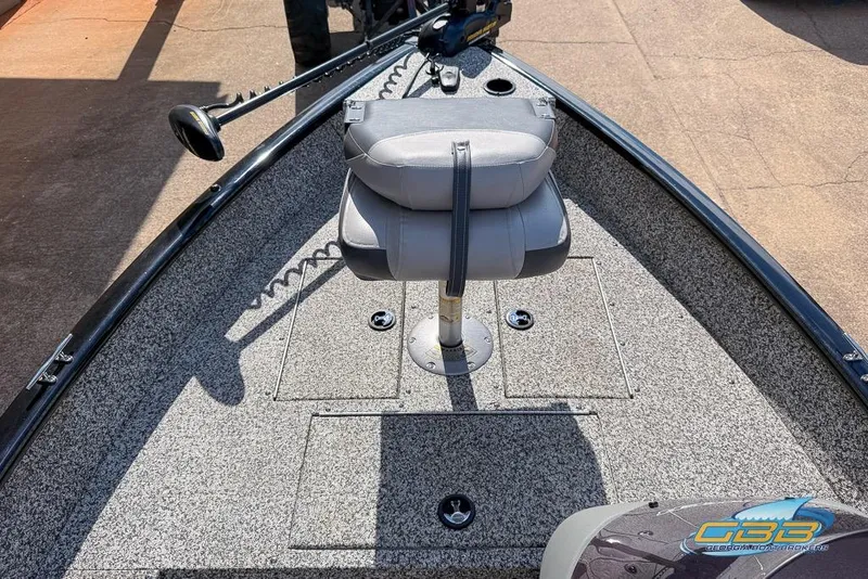 Slide: The Image of 2015 Tracker Super Guide V-16 SC boat interior with gray seating and carpeted deck. - 7