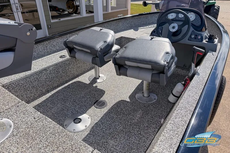 Slide: The Image of 2015 Tracker Super Guide V-16 SC boat interior with dual seats and steering console. - 8