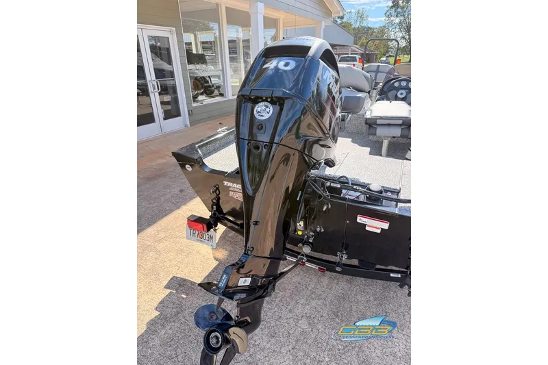 Slide: The Image of 2015 Tracker Super Guide V-16 SC boat with 40 HP outboard motor. - 9