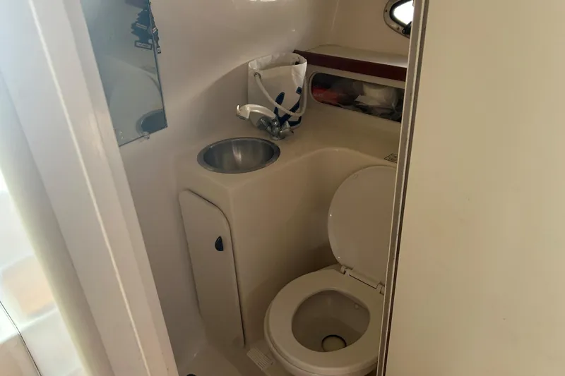 Slide: The Image of 1993 Tiara Yachts 3100 Open bathroom with sink and toilet. - 19