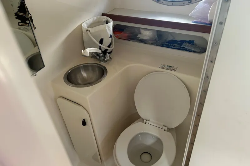 Slide: The Image of 1993 Tiara Yachts 3100 Open bathroom with sink and toilet. - 20