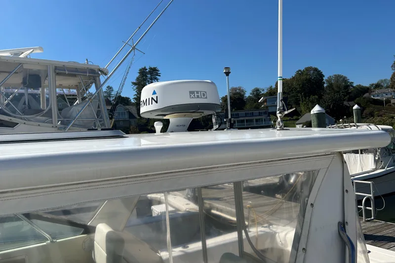 Slide: The Image of 1993 Tiara Yachts 3100 Open with Garmin xHD radar at marina. - 24