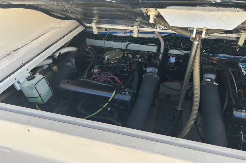 Slide: The Image of Engine compartment of a 1993 Tiara Yachts 3100 Open, showcasing mechanical components. - 28