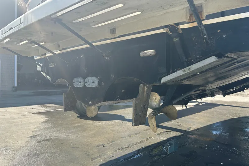 Slide: The Image of 1993 Tiara Yachts 3100 Open boat underside with propellers and rudders visible. - 30
