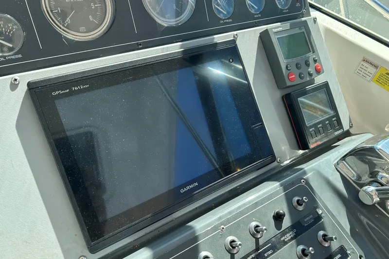 Slide: The Image of Dashboard of a 1993 Tiara Yachts 3100 Open with Garmin GPS and controls. - 6