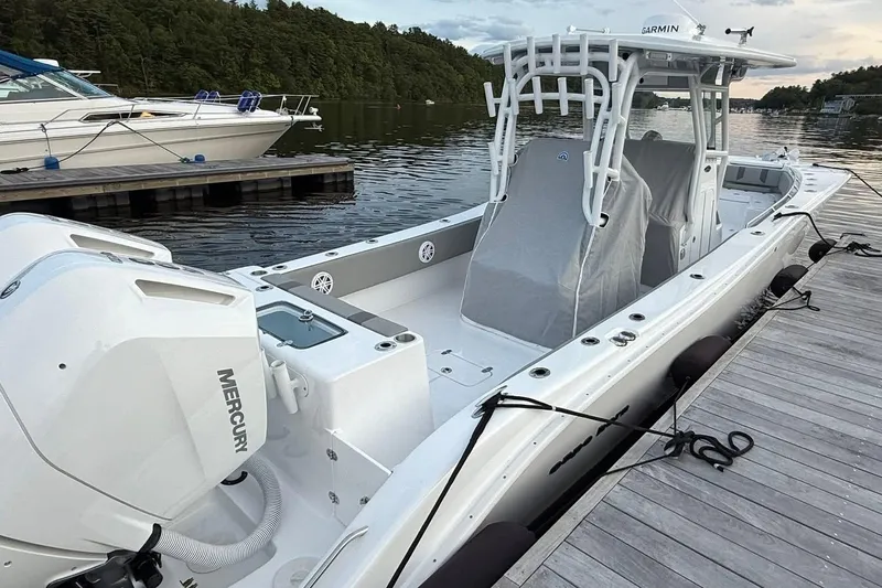 Slide: The Image of 2025 Cape Horn 34 XS boat docked, featuring Mercury engines and Garmin equipment. - 12