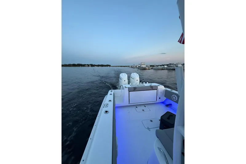 Slide: The Image of 2025 Cape Horn 34 XS boat cruising on calm waters at sunset. - 5