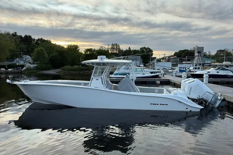 Slide: The Image of 2025 Cape Horn 34 XS boat docked at marina during sunset. - 14