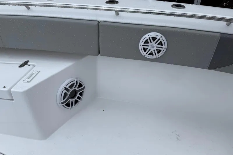 Slide: The Image of 2025 Cape Horn 34 XS boat interior with speakers and seating. - 17