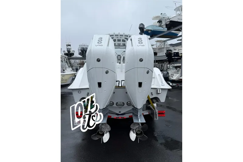 Slide: The Image of 2025 Cape Horn 34 XS boat with dual 400 V10 engines, docked in a marina. - 3