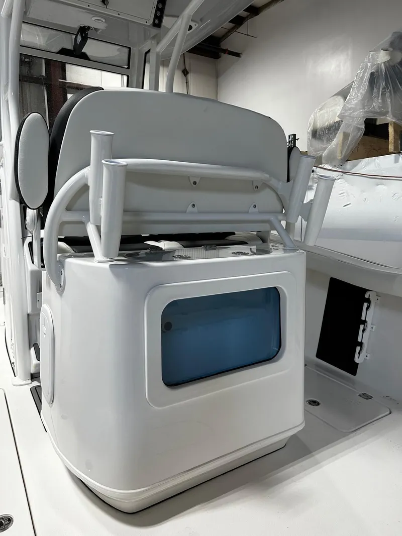 Slide: The Image of 2024 Tidewater 272 LXF boat interior with seating and storage compartment. - 20