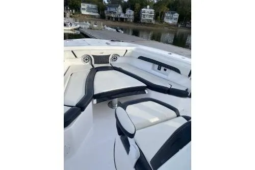 Slide: The Image of 2024 Tidewater 272 LXF boat interior with sleek seating and waterfront view. - 6