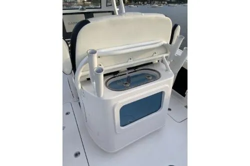 Slide: The Image of 2024 Tidewater 272 LXF boat with fishing rod holders and storage compartment. - 7