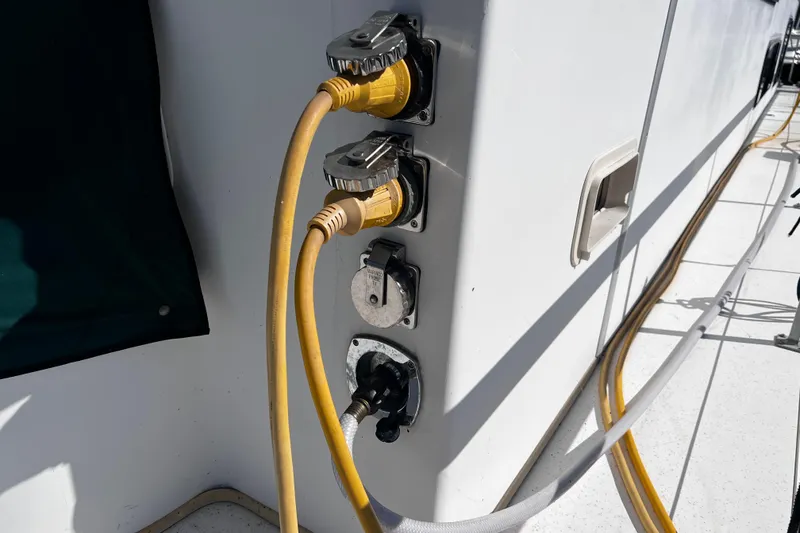 Slide: The Image of Electrical connections on a 1994 Gibson 44 Classic boat with yellow power cables. - 3