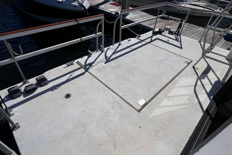 Slide: The Image of Deck of a 1994 Gibson 44 Classic boat at a marina. - 7