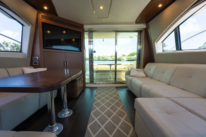 Slide: The Image of Luxurious interior of 2016 Sea Ray 510 Fly yacht with modern furnishings and large windows. - 15