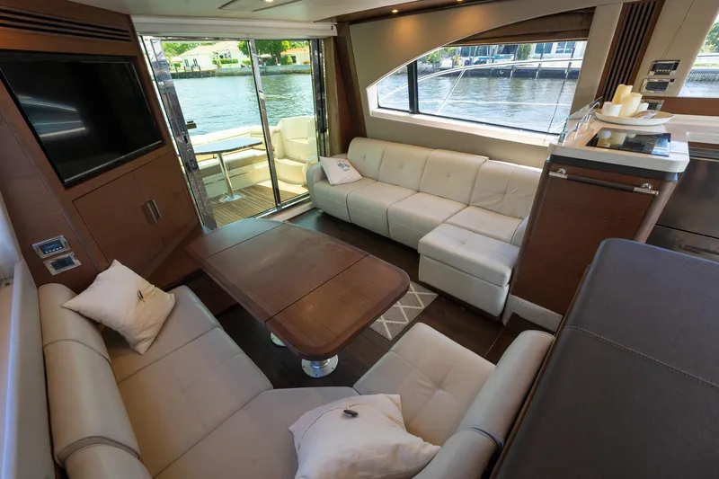 Slide: The Image of Luxurious interior of 2016 Sea Ray 510 Fly yacht with modern seating and waterfront view. - 17