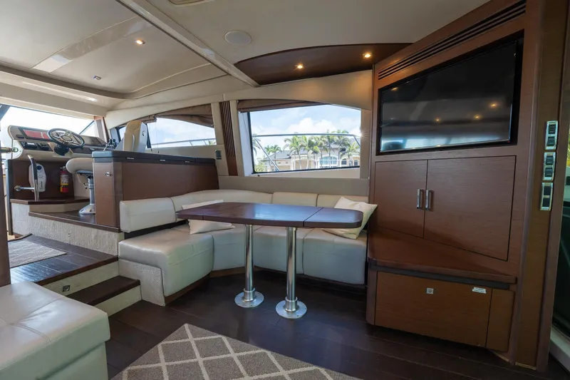 Slide: The Image of Interior of 2016 Sea Ray 510 Fly yacht with dining area and TV. - 18