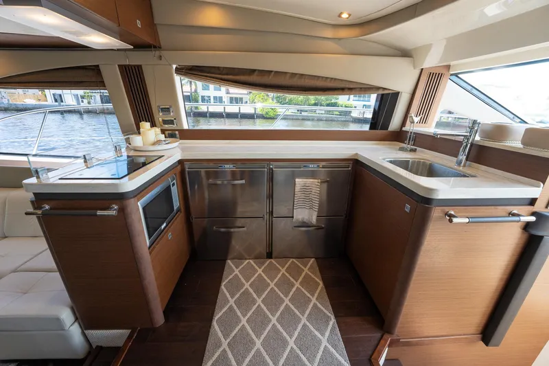 Slide: The Image of Modern kitchen area in 2016 Sea Ray 510 Fly yacht with stainless steel appliances. - 19