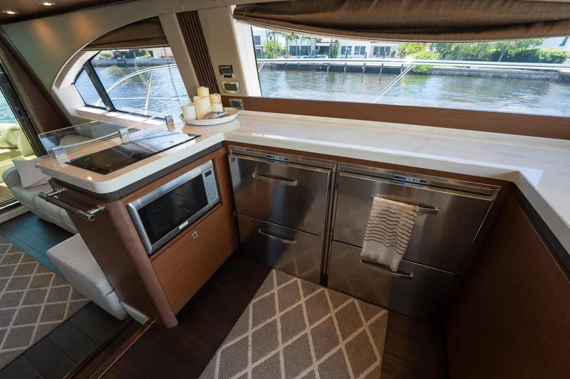 Slide: The Image of Modern kitchen area on a 2016 Sea Ray 510 Fly yacht with stainless steel appliances. - 20