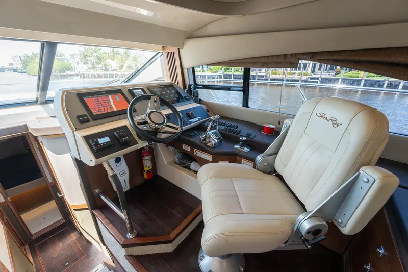 Slide: The Image of Helm station of 2016 Sea Ray 510 Fly yacht with leather captain's chair. - 23