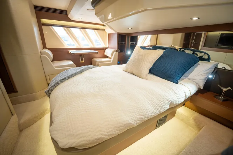 Slide: The Image of Luxurious bedroom interior of 2016 Sea Ray 510 Fly yacht with cozy bed and seating area. - 26