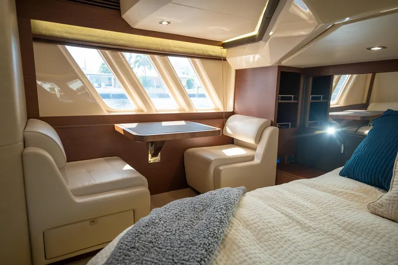 Slide: The Image of Luxurious interior of 2016 Sea Ray 510 Fly yacht with seating and table. - 27