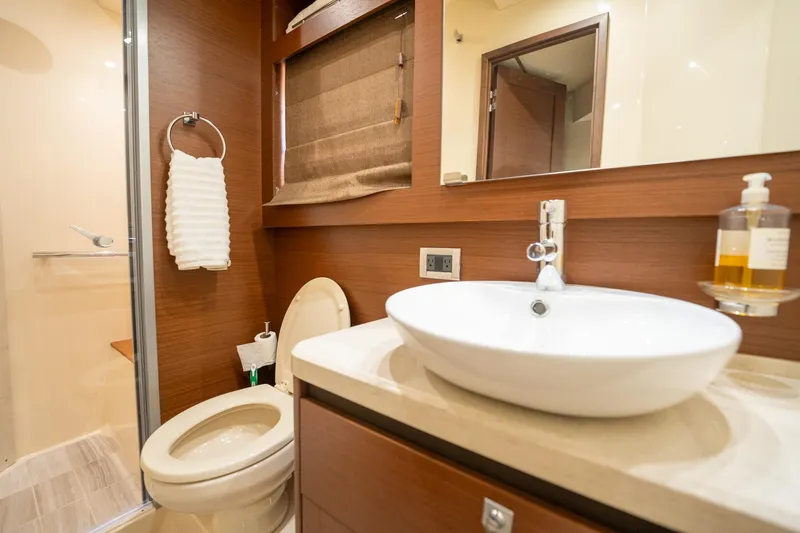 Slide: The Image of Modern bathroom in 2016 Sea Ray 510 Fly yacht with sink, toilet, and shower. - 28