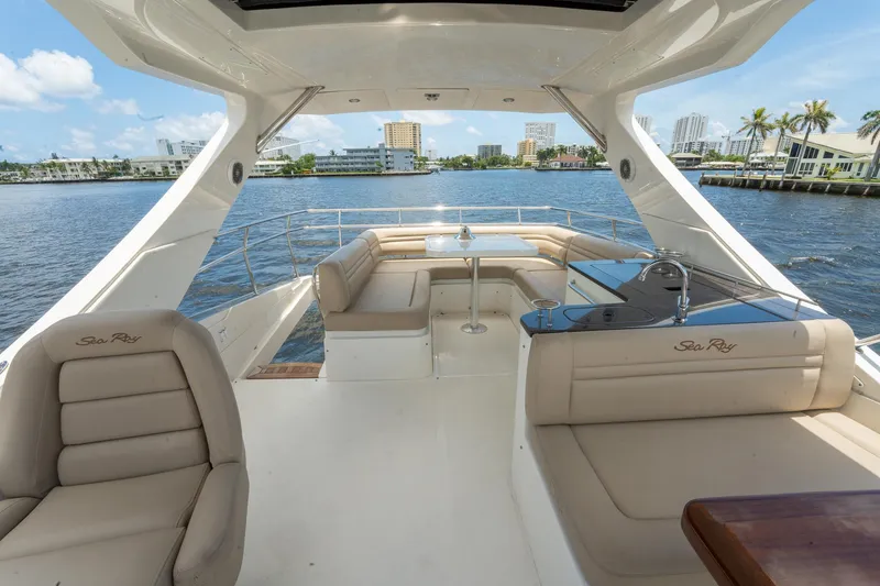 Slide: The Image of 2016 Sea Ray 510 Fly yacht with spacious deck and waterfront view. - 33