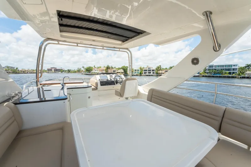 Slide: The Image of 2016 Sea Ray 510 Flybridge yacht with spacious seating and scenic water views. - 37
