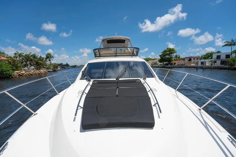 Slide: The Image of 2016 Sea Ray 510 Fly yacht cruising on a sunny day. - 9