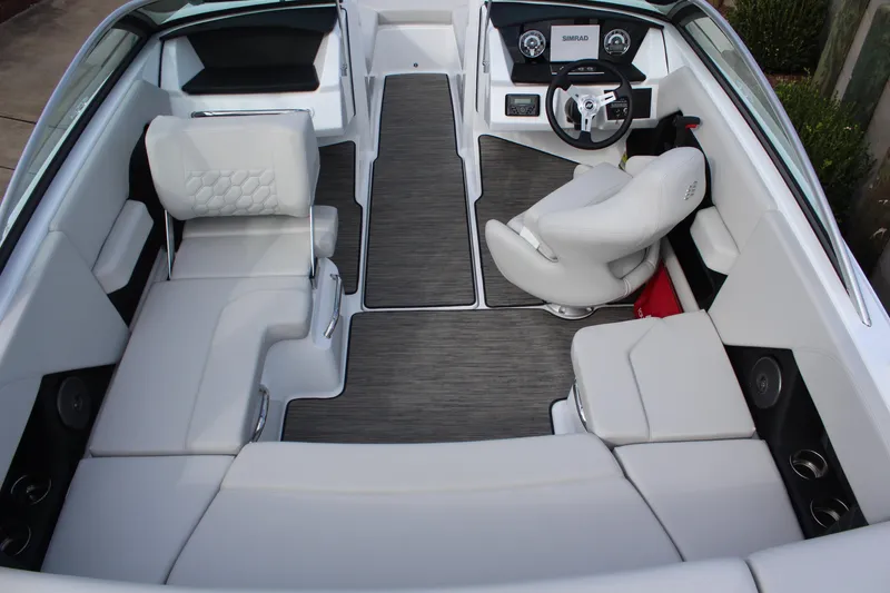 Slide: The Image of 2026 Four Winns H2 Freedom boat interior with modern seating and sleek dashboard design. - 11