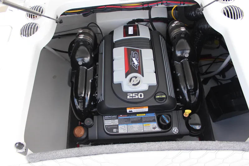 Slide: The Image of Engine compartment of 2026 Four Winns H2 Freedom boat, featuring a Mercury 4.5L 250 engine. - 19