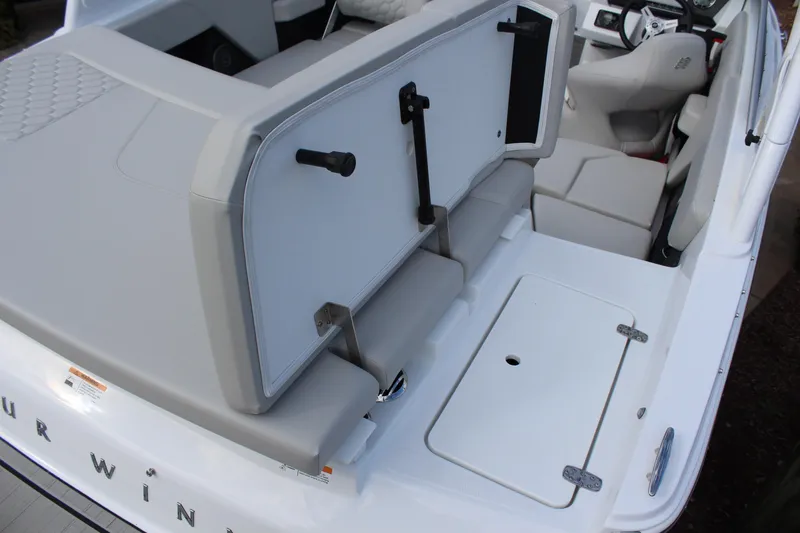 Slide: The Image of 2026 Four Winns H2 Freedom boat interior with seating and storage compartments. - 9