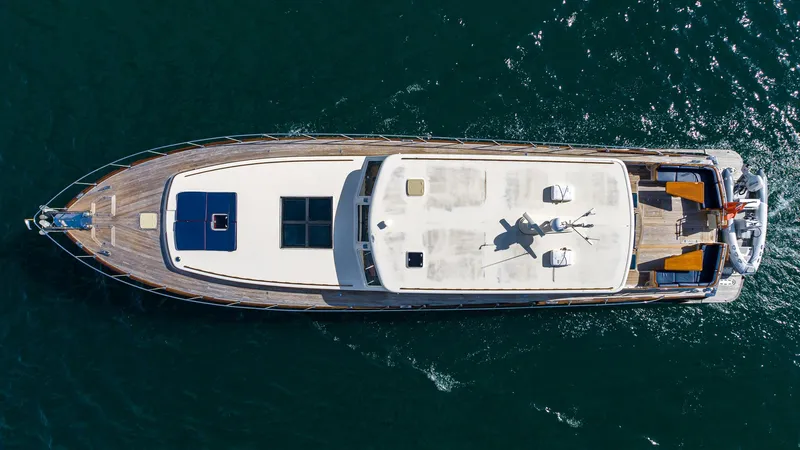 Slide: The Image of Aerial view of 2006 Vicem 85 Classic yacht on open water. - 10