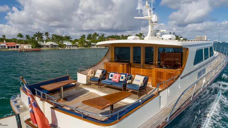Slide: The Image of Luxurious 2006 Vicem 85 Classic yacht cruising on a sunny day, featuring elegant outdoor seating. - 14