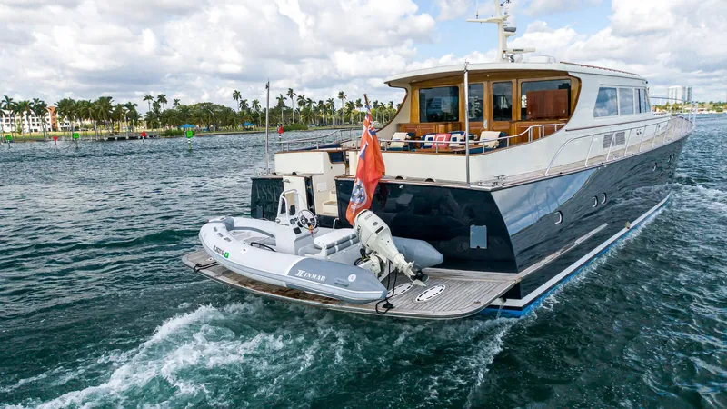 Slide: The Image of 2006 Vicem 85 Classic yacht cruising on open water with inflatable boat attached. - 20