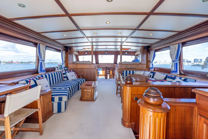 Slide: The Image of Luxurious interior of 2006 Vicem 85 Classic yacht with elegant woodwork and striped seating. - 21