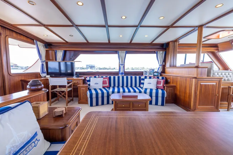 Slide: The Image of Luxurious interior of 2006 Vicem 85 Classic yacht with elegant wood finish and striped seating. - 25