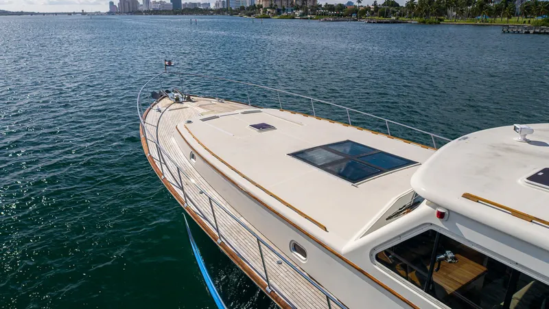 Slide: The Image of Vicem 85 Classic 2006 yacht cruising on calm waters, showcasing elegant design and spacious deck. - 6