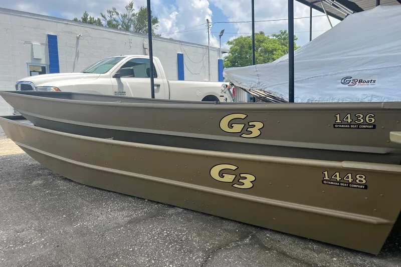 Slide: The Image of 2026 G3 Gator Tough 1436 boats displayed outdoors near a white truck. - 10