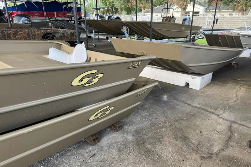 Slide: The Image of 2026 G3 Gator Tough 1436 boats displayed in a showroom, showcasing durable design. - 6